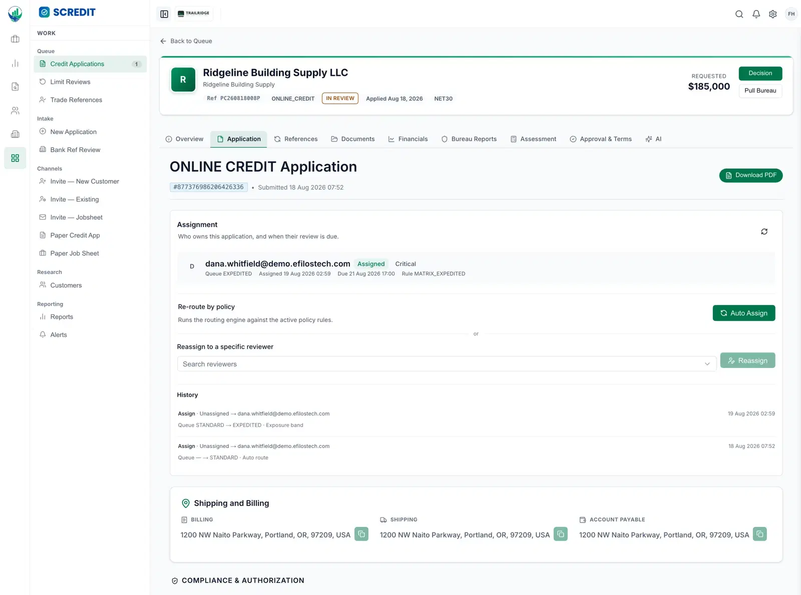 The SCREDIT assignment panel on a credit application. It names the analyst who owns the file, the queue it sits in, when it was assigned, when the review is due, and which routing rule placed it there. Controls beneath re-run the routing engine against current policy or reassign to a named reviewer. A history list records each assignment in turn, the queue it moved from and to, and the reason the rule fired — here a move from the standard queue to the expedited queue on exposure band.